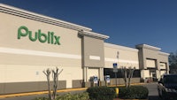 the front of a publix store with cars parked in front of it