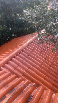 a red tiled roof on a house